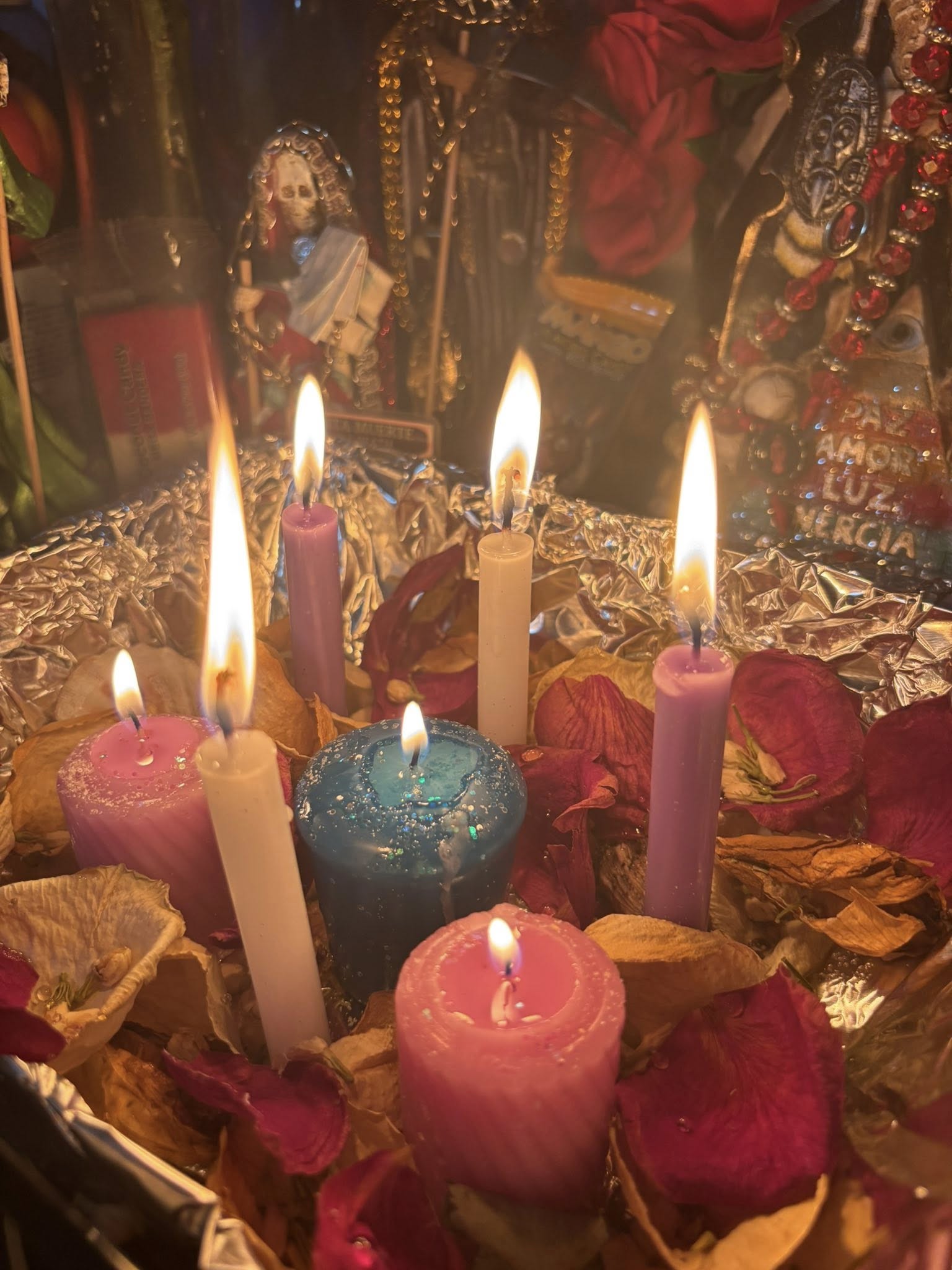 Sacred altar with candles and rose petals